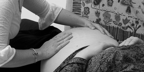 Dana Balassi working with pregnant woman